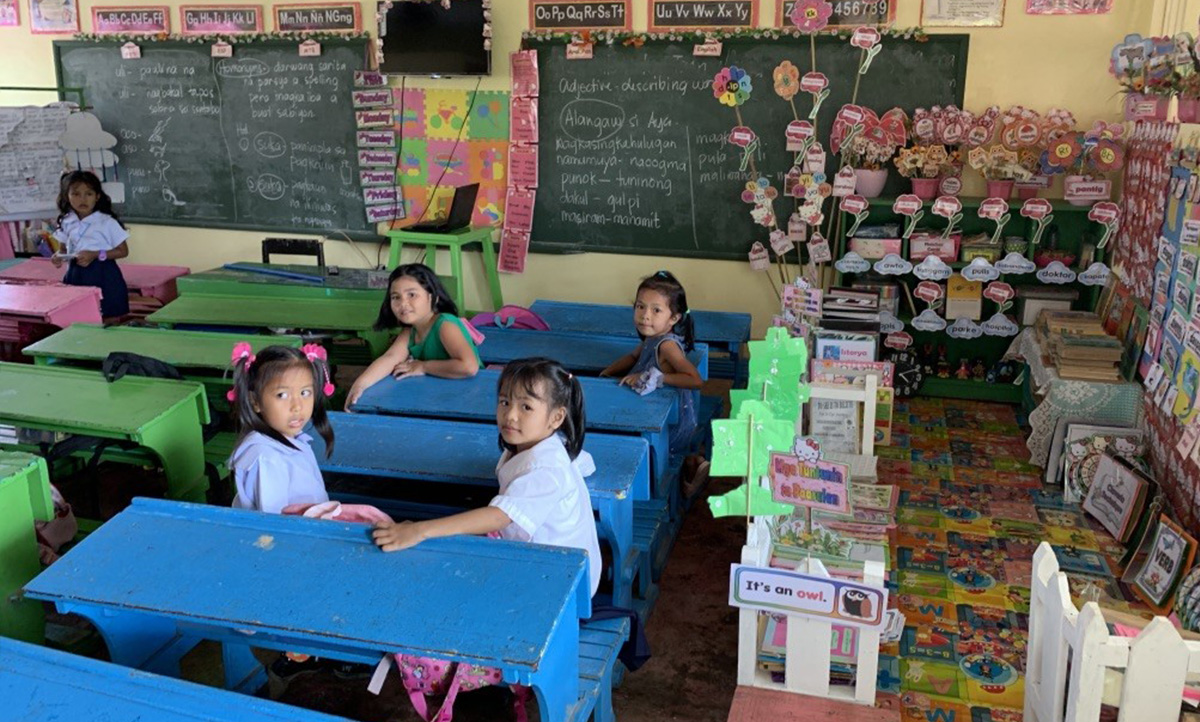 Students sitting in a classroom in the Philippines.